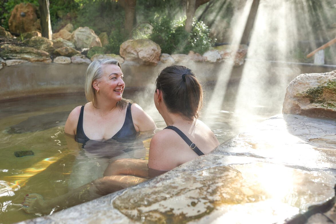 Two women bathing in hot springs